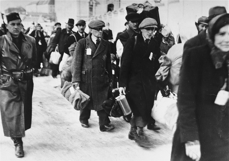 Deportation of Slovak Jews. The victims wear tags and are escorted by Slovak guards. [LCID: 77933]
